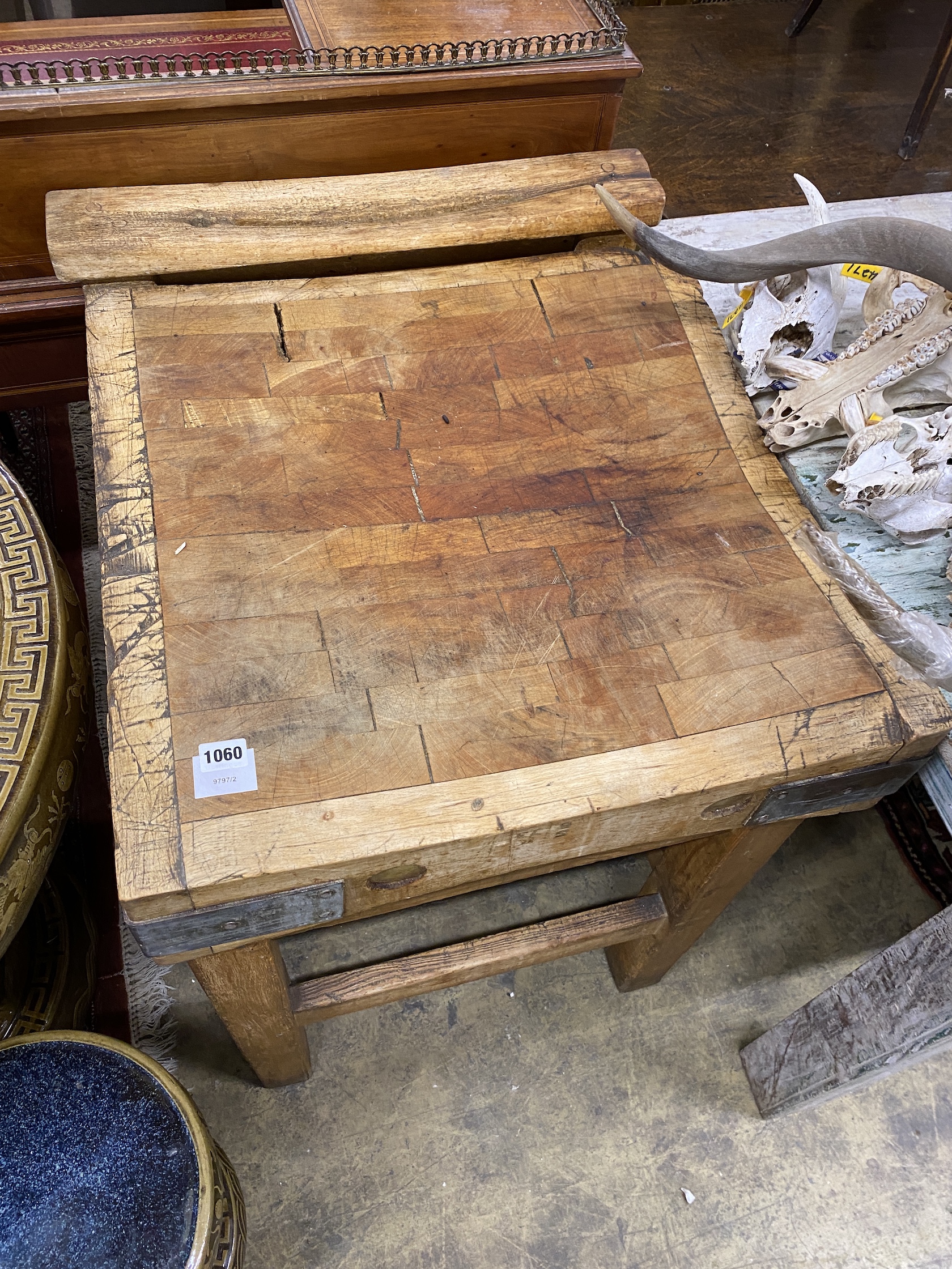 A Victorian iron bound pine butcher's block, width 61cm, depth 70cm, height 86cm